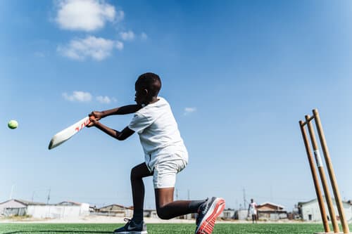 A young cricketer batting during a Catch Trust session in South Africa